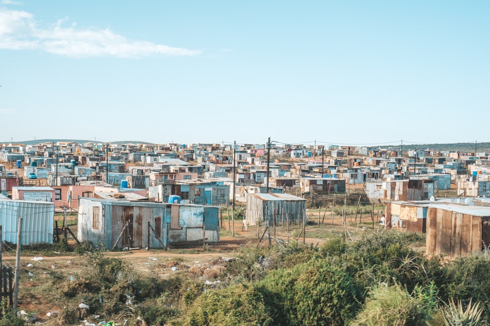 a group of shacks sitting in the middle of a field