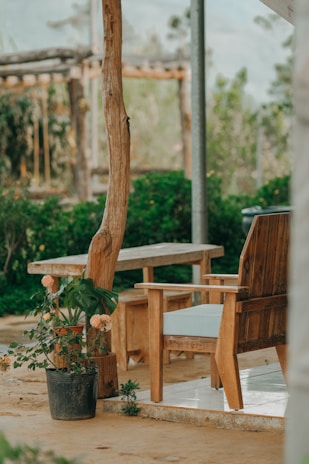 Outdoor seating area with wooden furniture, ideal for enjoying morning coffee or evening conversations.
