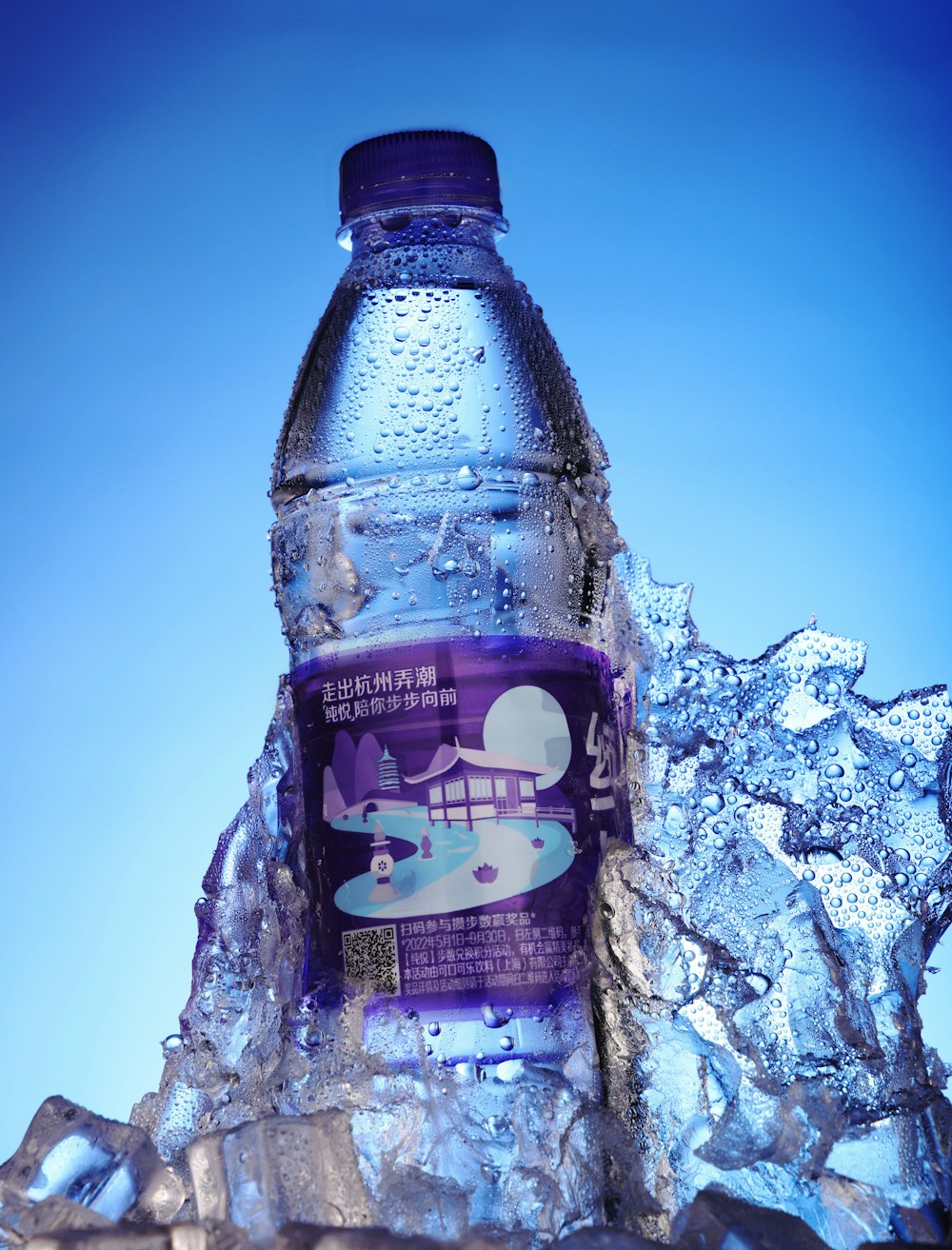 a bottle of water sitting on top of ice