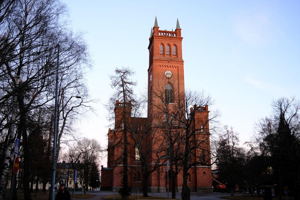 a tall building with a clock on the front of it