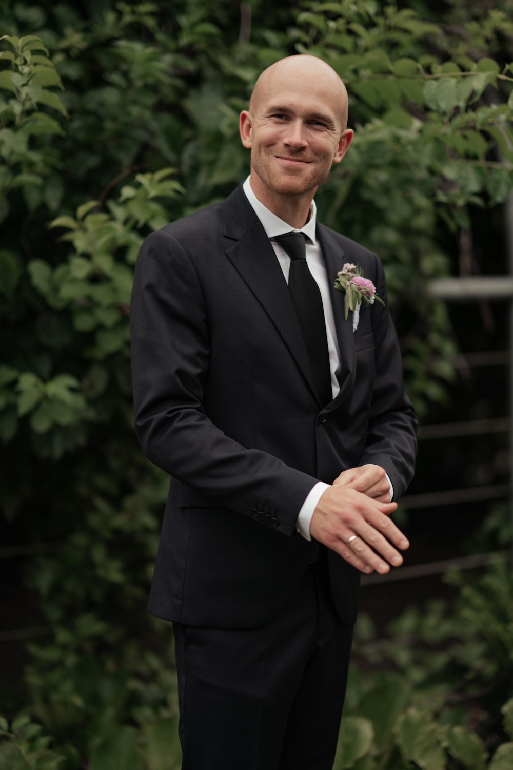a man in a suit and tie posing for a picture