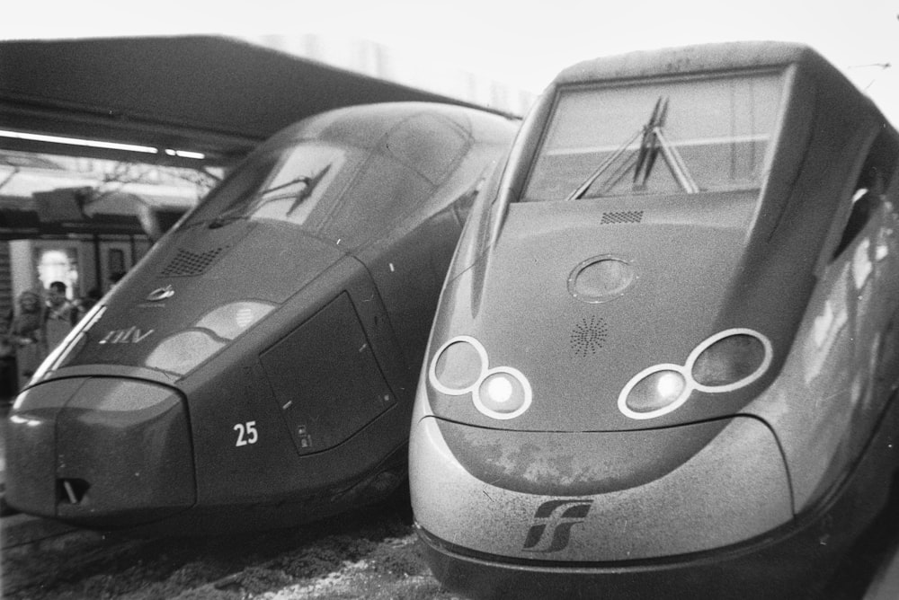 a couple of trains parked next to each other