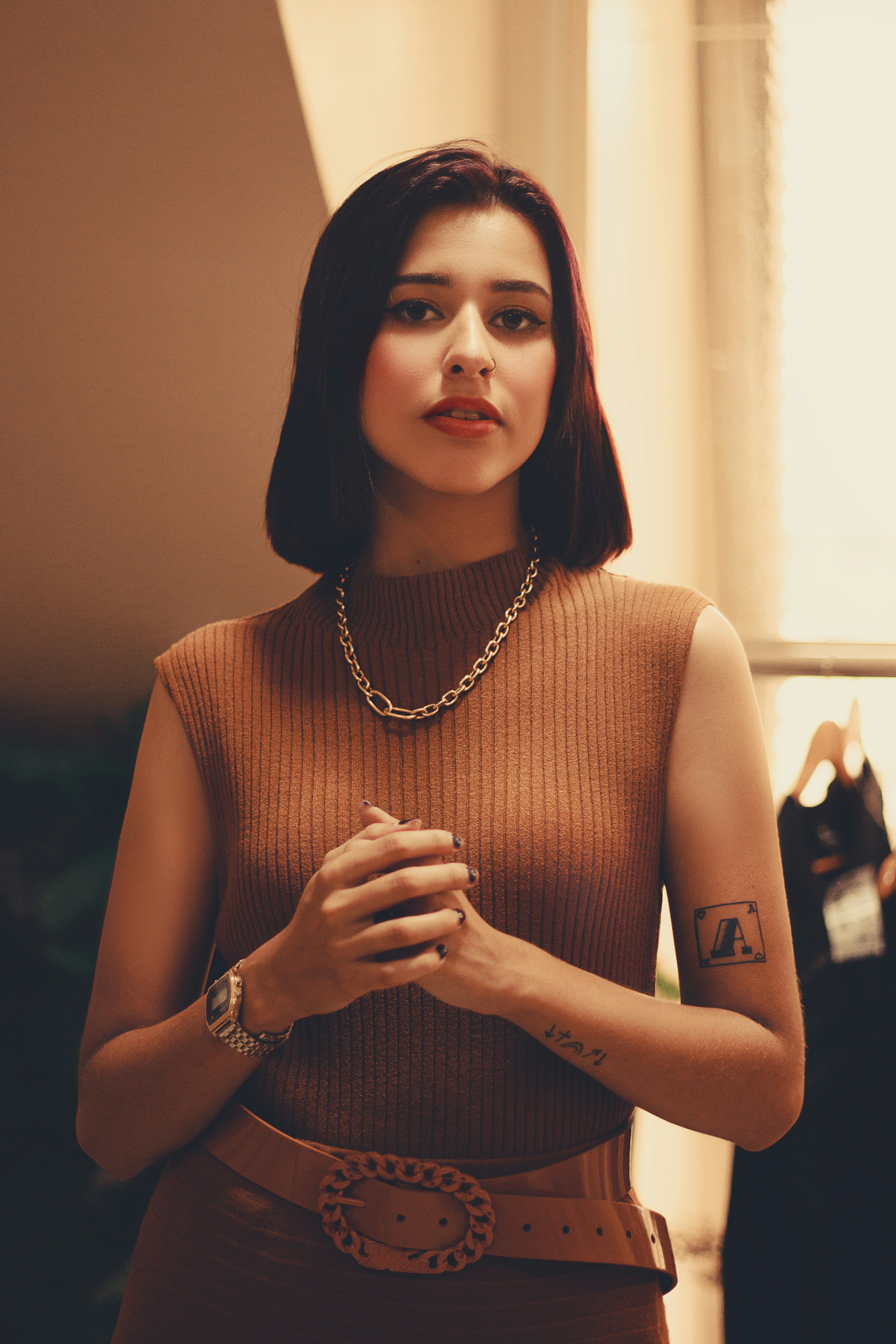 a woman with a tattoo on her arm