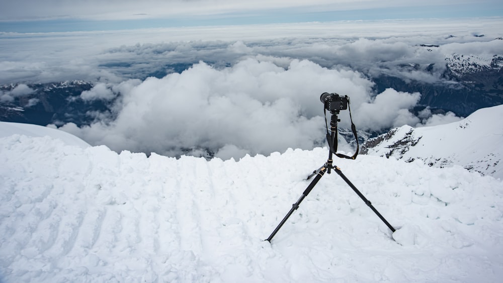 a pair of skis sitting on top of a snow covered slope