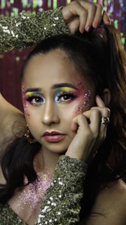 A vibrant party makeup style featuring bold colors and creative designs.