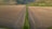 Aerial view of a vast soybean field under a clear sky.