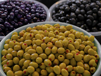 Variety of olives in bowls showcasing different colors and textures