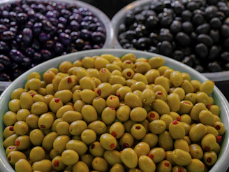 Variety of olives in bowls showcasing different colors and textures