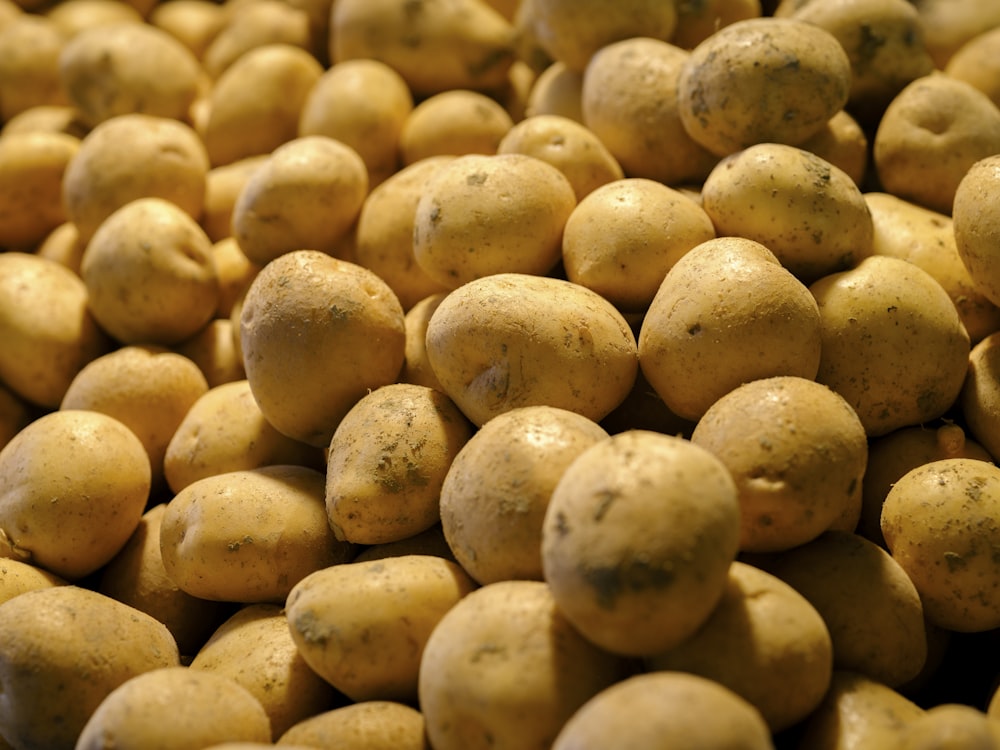 a pile of potatoes sitting on top of a table