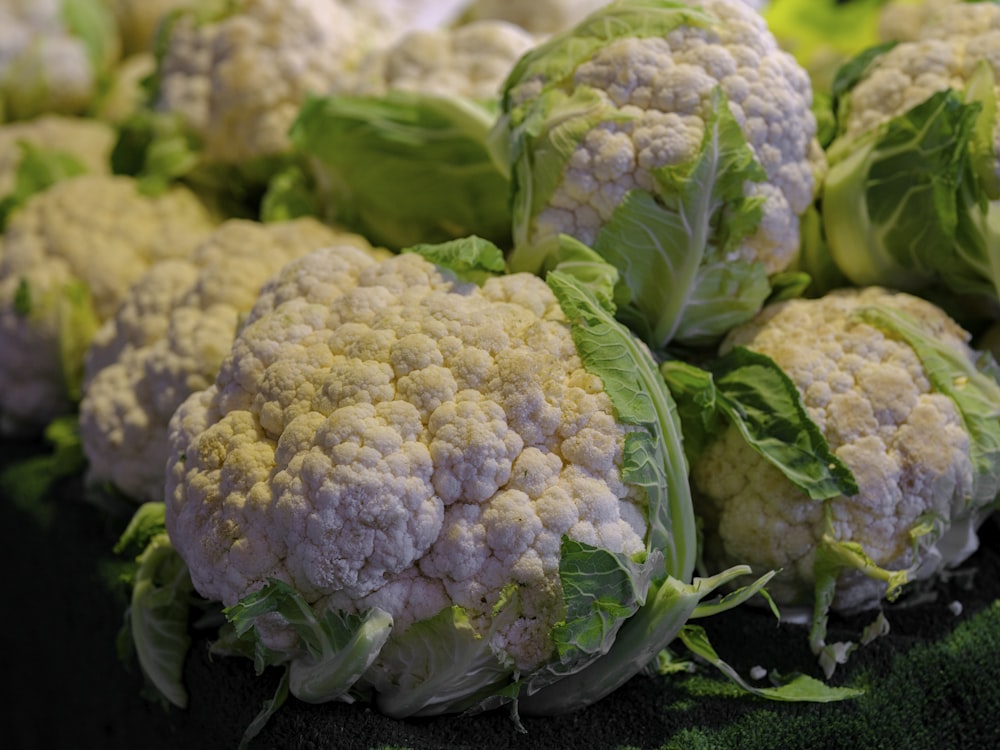 a pile of cauliflower sitting on top of a table