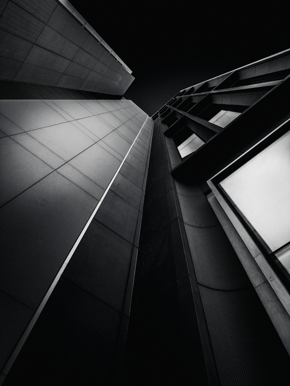 a black and white photo of a tall building