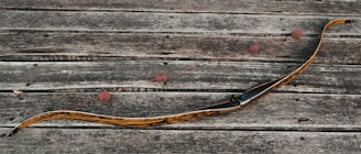 a snake like object on a wooden surface