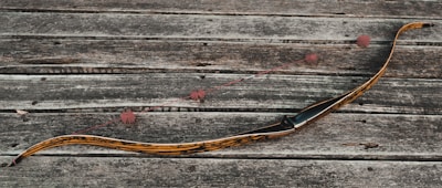 a snake like object on a wooden surface