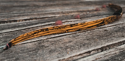 a banana sitting on top of a wooden table
