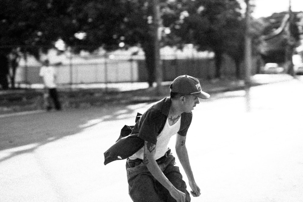 a man riding a skateboard down a street