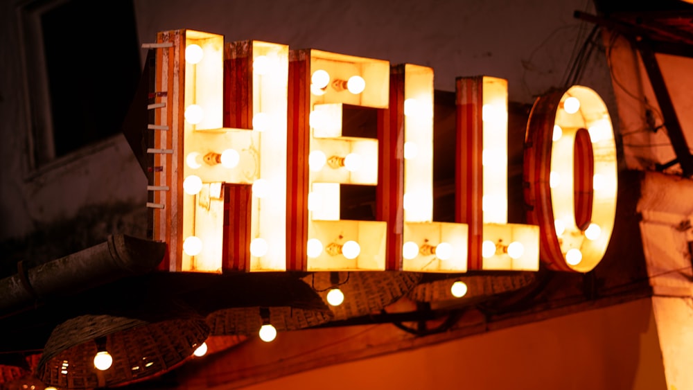 a lighted sign that says hello on it