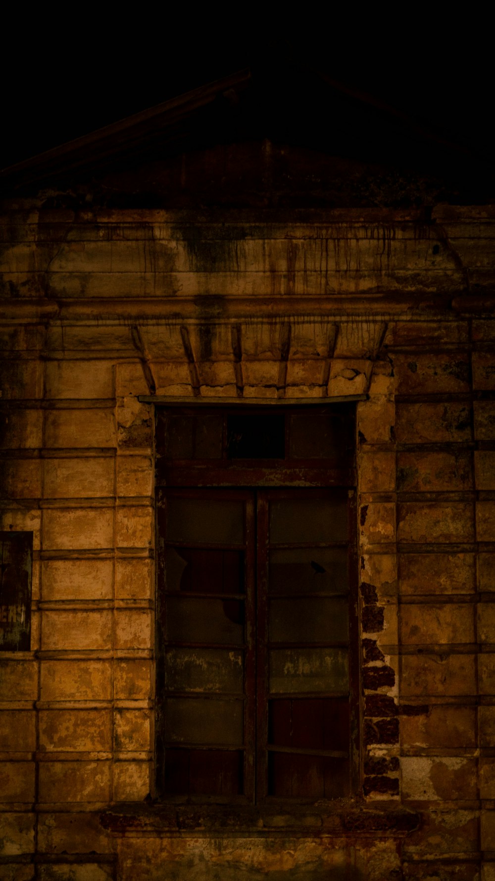 an old building with a clock on the front of it