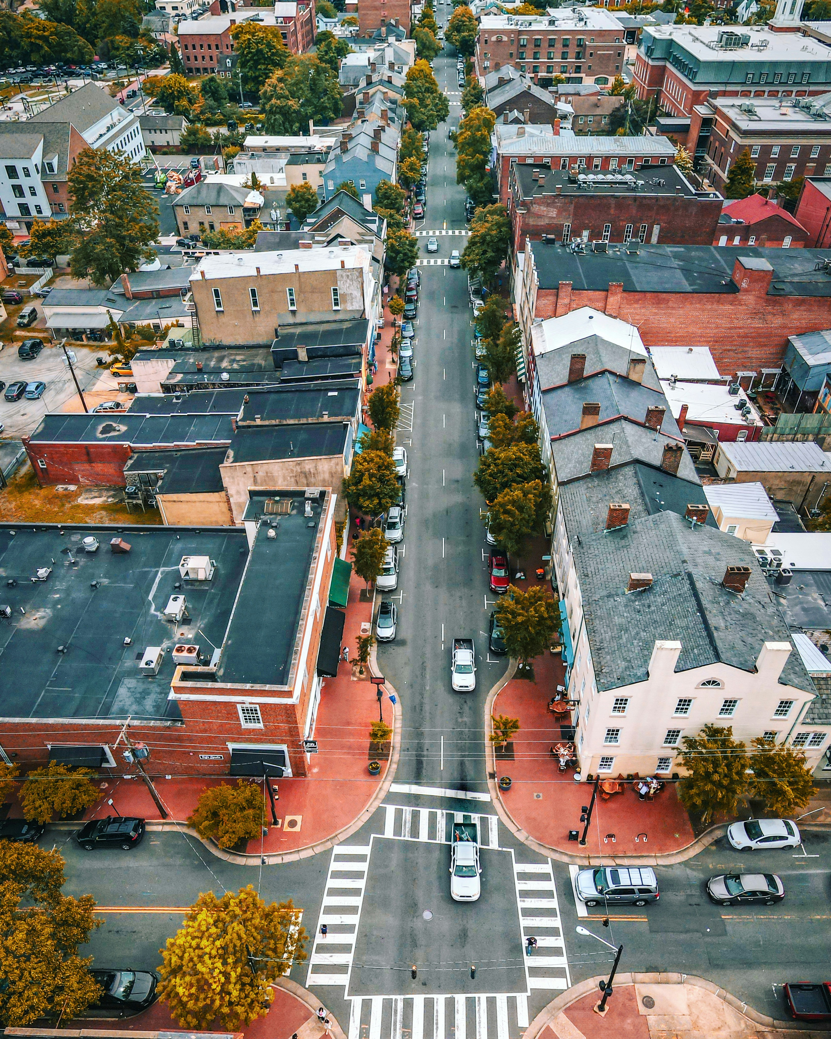 an aerial view of a city with a crosswalk