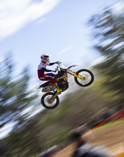 Action shot of a motocross rider mid-air captured with dynamic filming equipment in Florida.