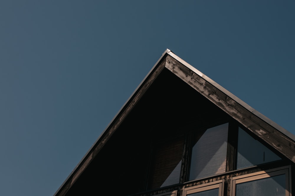 the top of a building with a sky background