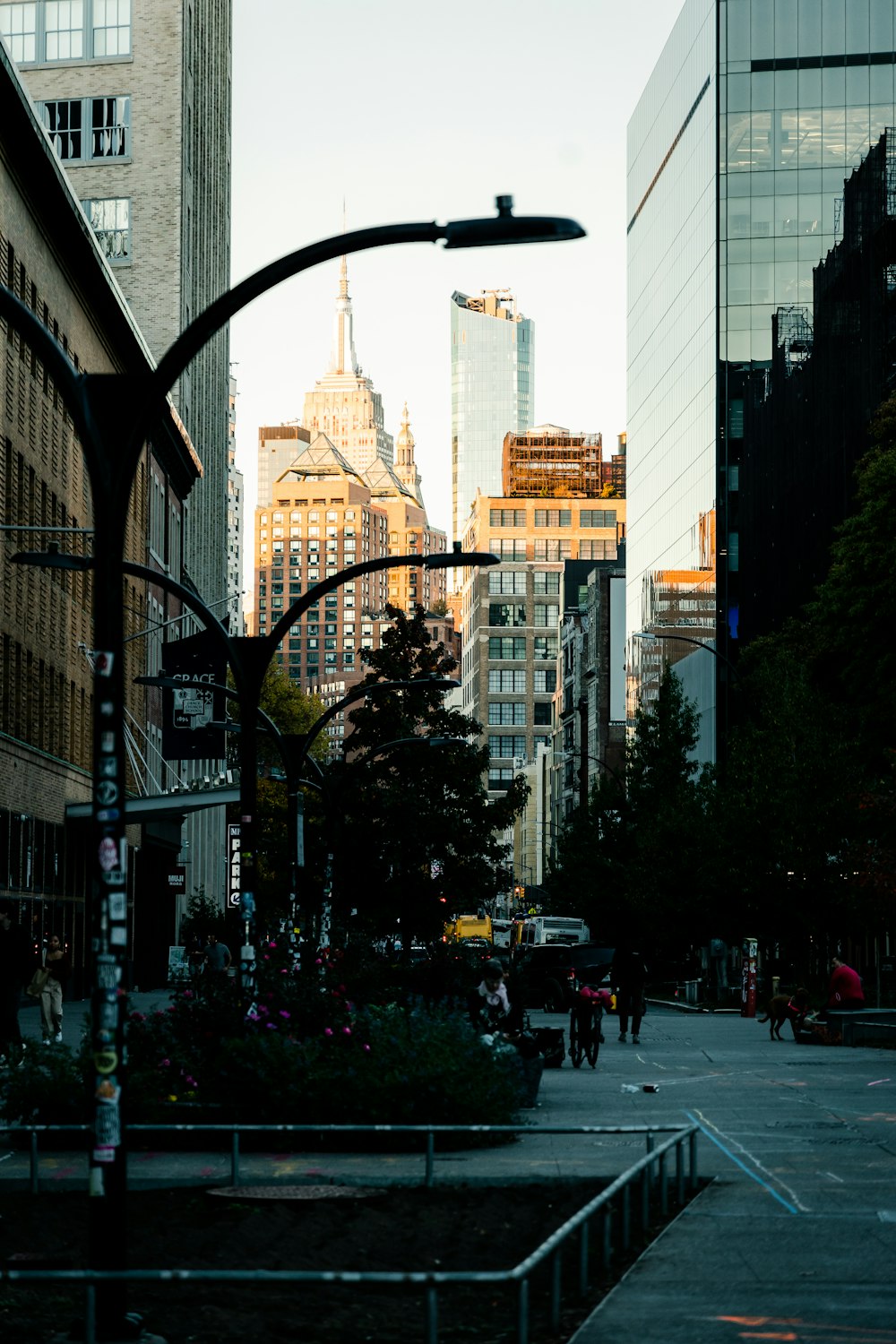 a city street with tall buildings in the background