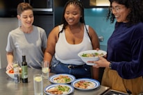 A friendly gathering of people sharing healthy recipes.
