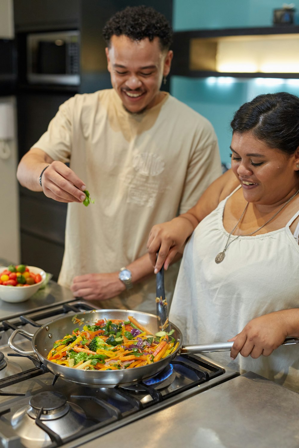 people preparing food in a kitchen