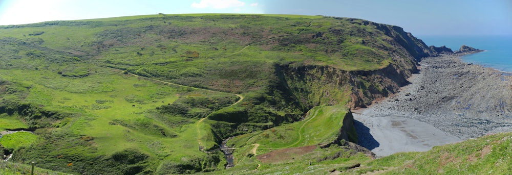 a scenic view of the ocean from the top of a hill