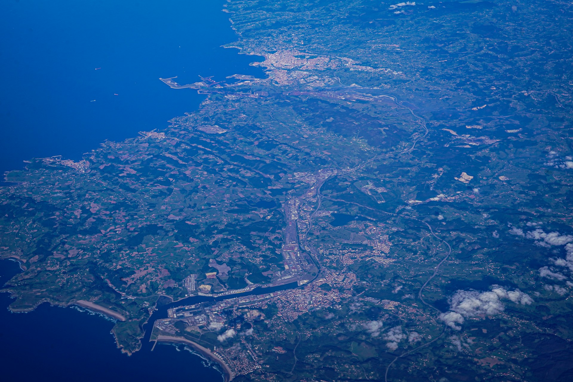 an aerial view of a city and a body of water