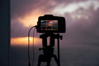 Close-up of Ahmad’s camera on a tripod against a sunrise backdrop.