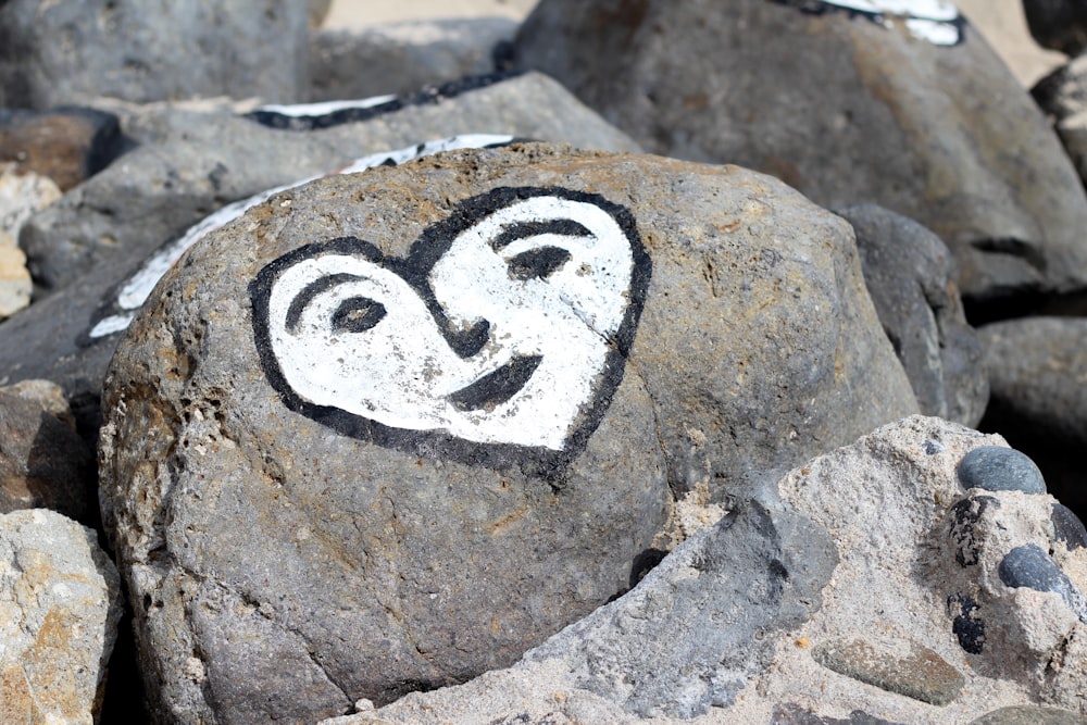 a rock with a face painted on it