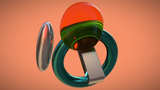 A collection of geometric shapes including a shiny metallic ellipse, a transparent orange and green sphere, a teal ring, and a reflective rectangular prism, arranged against a smooth, peach-colored background.