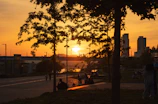 A sunset view over a neighborhood park where locals connect and unwind.