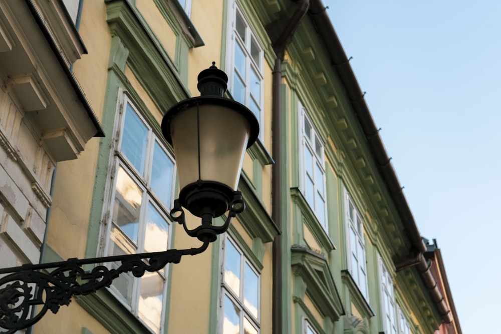 a street light hanging from the side of a building