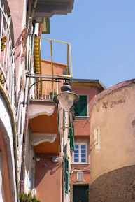 Elegant old town streets of Cap Valéor with soft beige buildings and blue shutters.
