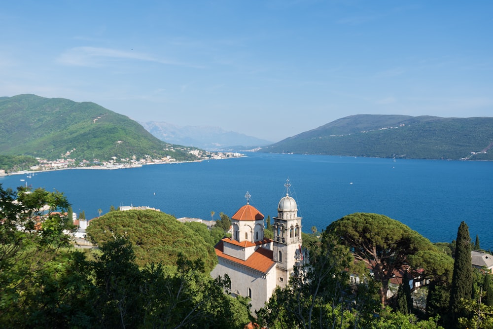 a church on a hill overlooking a body of water