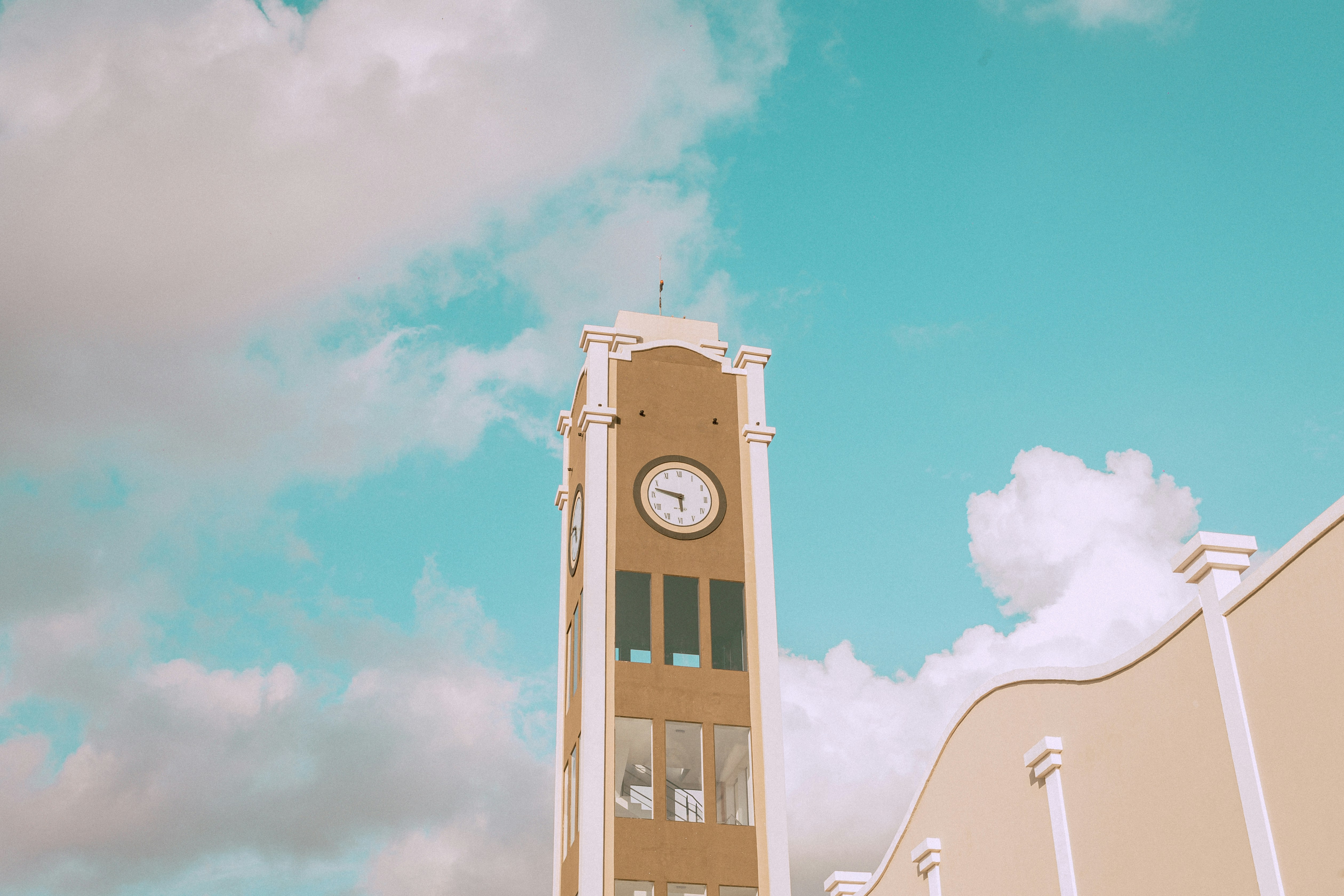 a tall clock tower with a sky background