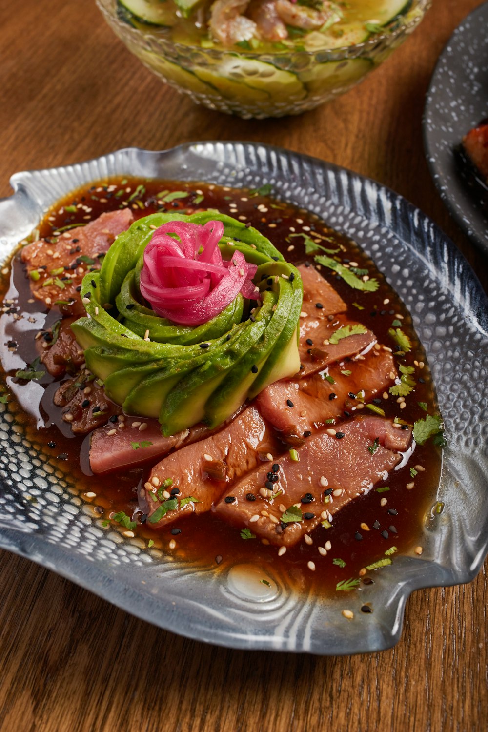 a plate of food on a wooden table