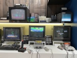 A vibrant display of various video game consoles and controllers.