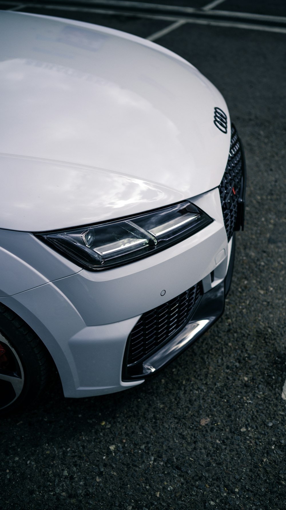 a white car parked in a parking lot