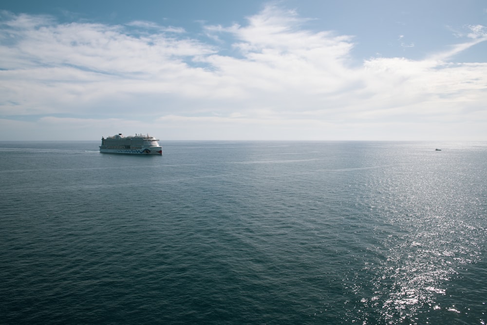 a large boat floating on top of a large body of water