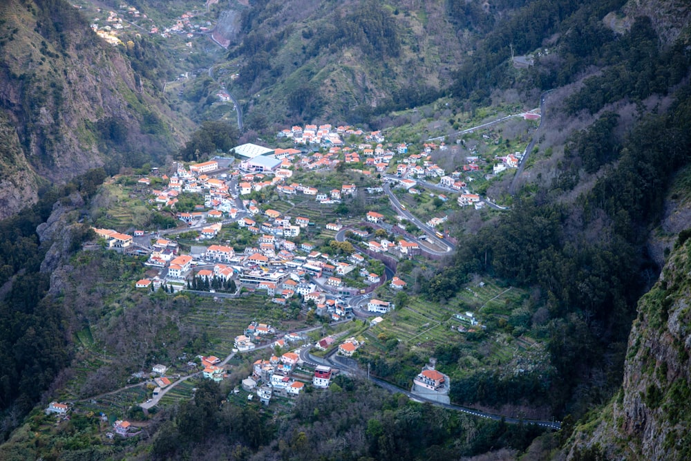 an aerial view of a village in the mountains