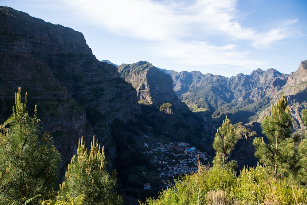 a view of a valley with mountains in the background