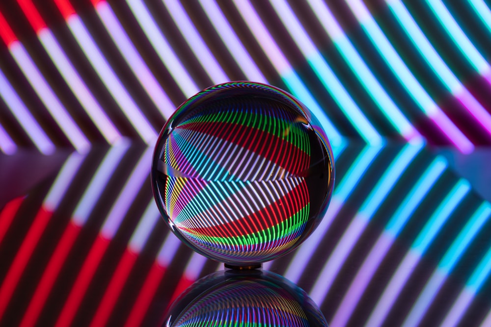 a colorful glass object sitting on top of a table