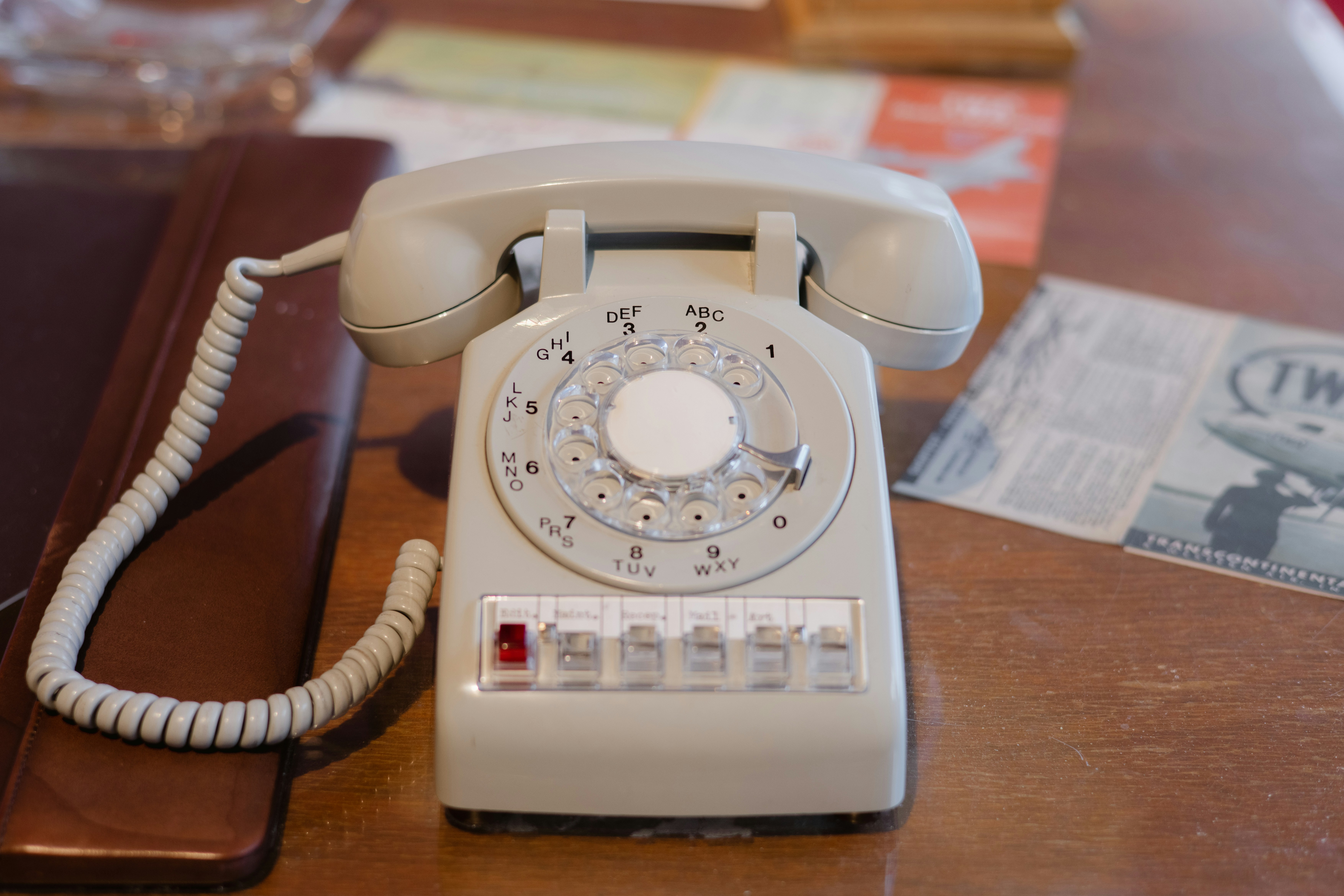 an old style telephone sitting on a table, 
