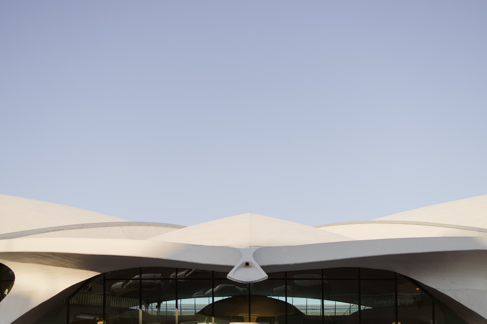 a large white building with a sky in the background