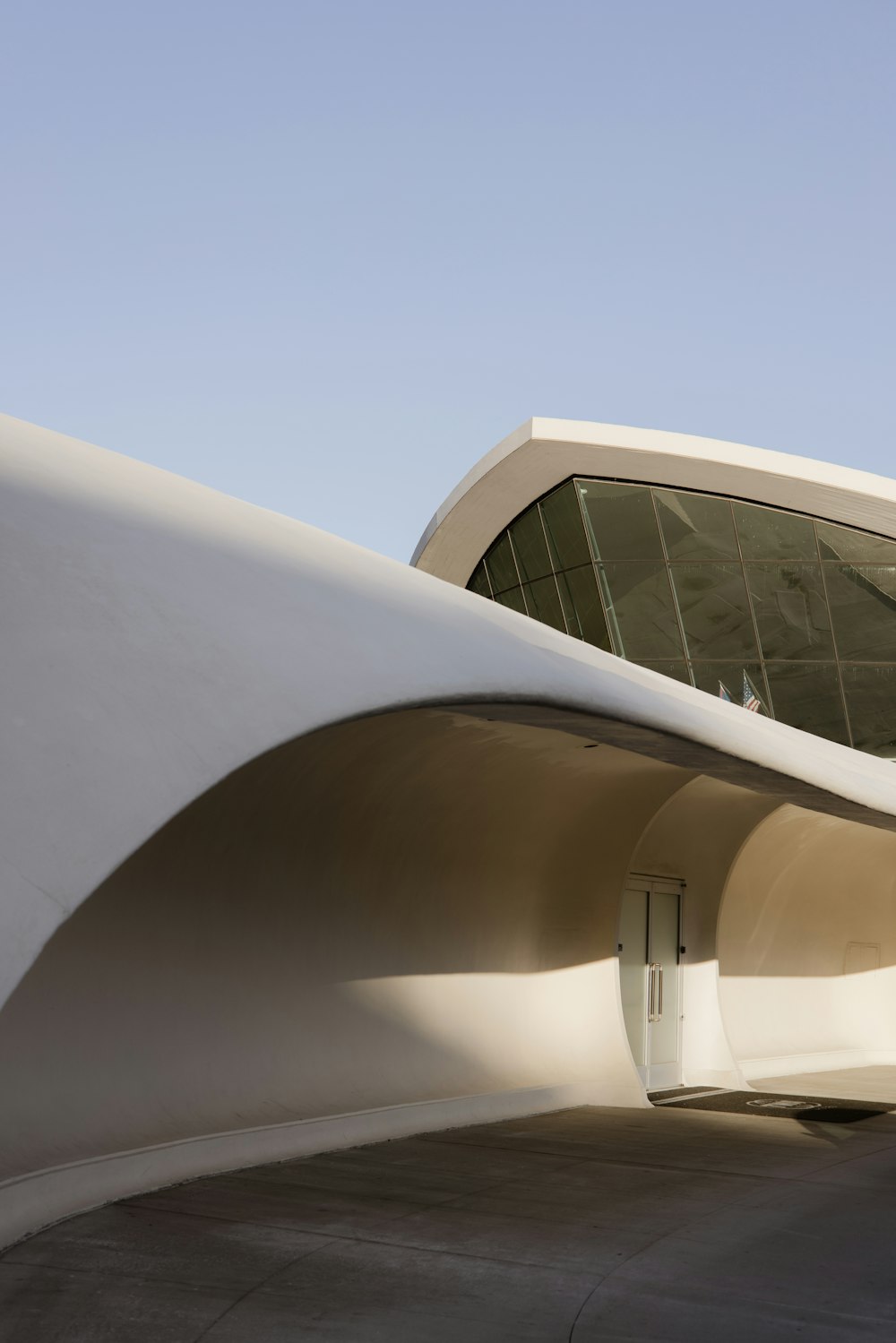 a large white building with a curved roof