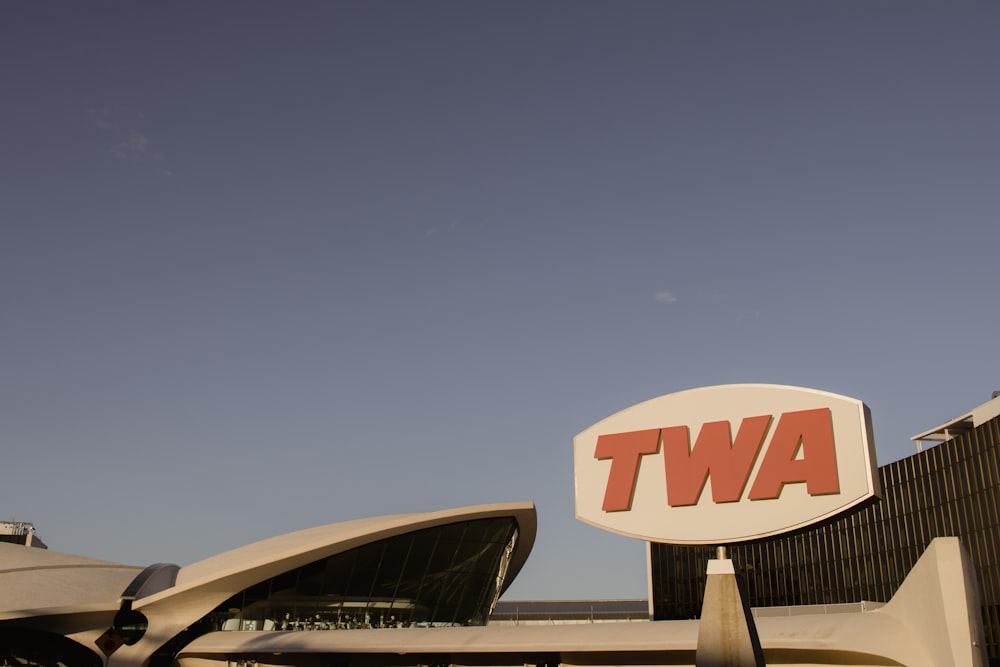 a large twa sign in front of a building