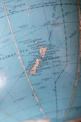 A vibrant map of New Zealand dotted with icons representing various AI companies and apps.