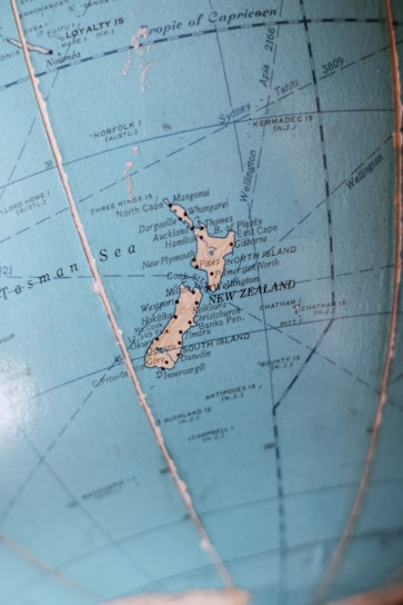 A vibrant map of New Zealand dotted with icons representing various AI apps and companies.